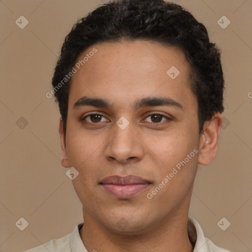 Joyful latino young-adult male with short  brown hair and brown eyes