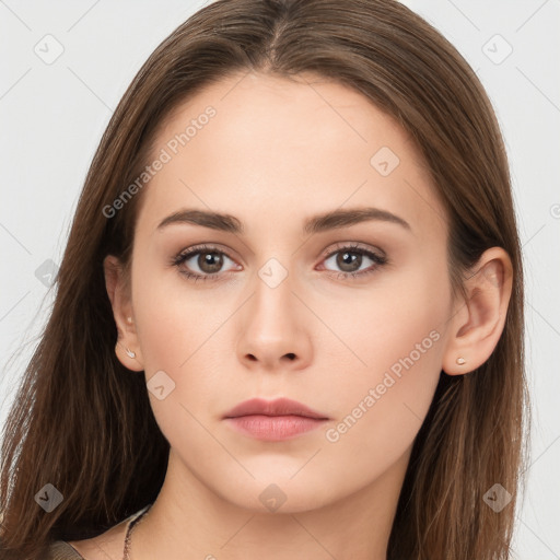 Neutral white young-adult female with long  brown hair and brown eyes