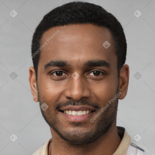 Joyful black young-adult male with short  black hair and brown eyes