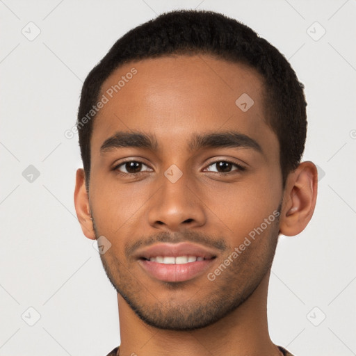 Joyful latino young-adult male with short  brown hair and brown eyes