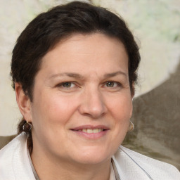 Joyful white adult female with medium  brown hair and brown eyes