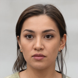 Neutral white young-adult female with medium  brown hair and brown eyes