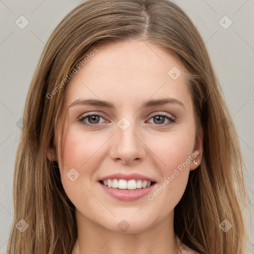 Joyful white young-adult female with long  brown hair and green eyes