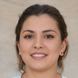 Joyful white young-adult female with medium  brown hair and brown eyes