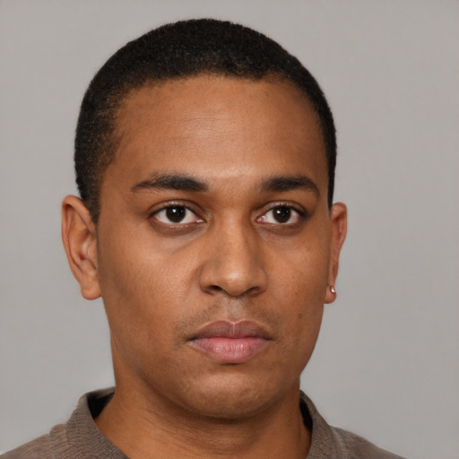 Neutral latino young-adult male with short  brown hair and brown eyes