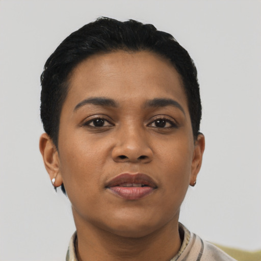 Joyful latino young-adult female with short  black hair and brown eyes