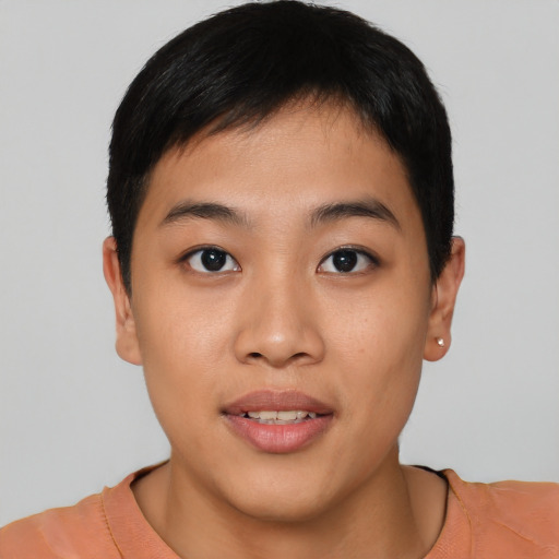 Joyful asian young-adult female with short  brown hair and brown eyes