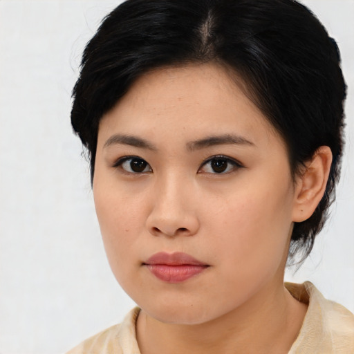 Neutral asian young-adult female with medium  brown hair and brown eyes
