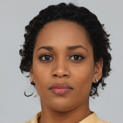 Neutral black young-adult female with medium  black hair and brown eyes