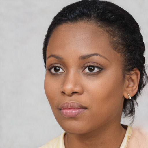 Neutral black young-adult female with short  black hair and brown eyes