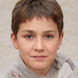 Joyful white child male with short  brown hair and brown eyes