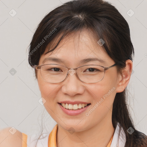 Joyful white adult female with medium  brown hair and brown eyes