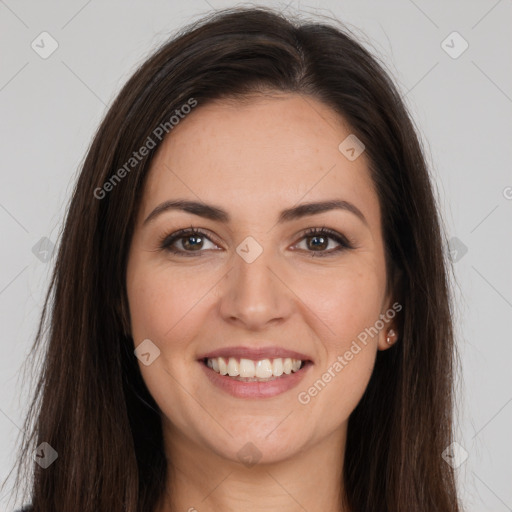 Joyful white young-adult female with long  brown hair and brown eyes