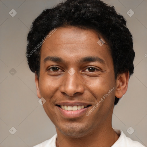 Joyful black young-adult male with short  black hair and brown eyes