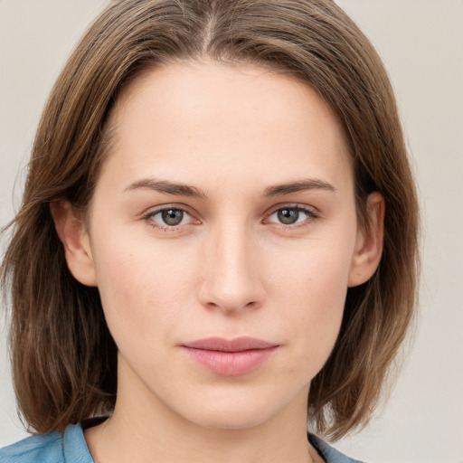 Neutral white young-adult female with medium  brown hair and grey eyes