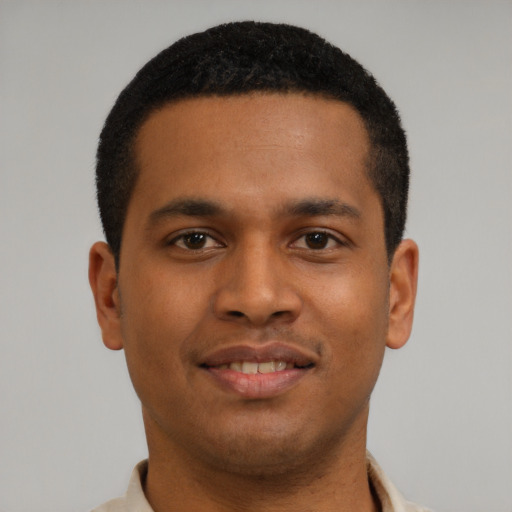 Joyful latino young-adult male with short  brown hair and brown eyes