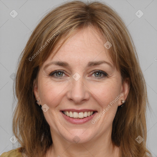 Joyful white adult female with medium  brown hair and grey eyes