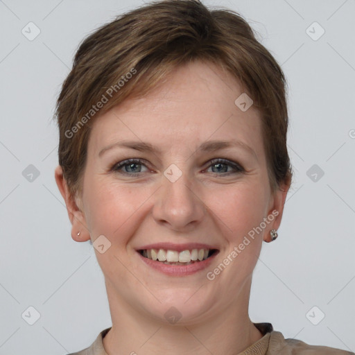 Joyful white young-adult female with short  brown hair and grey eyes