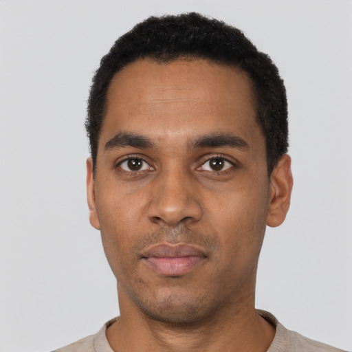Neutral black young-adult male with short  black hair and brown eyes