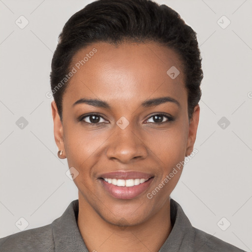 Joyful black young-adult female with short  black hair and brown eyes