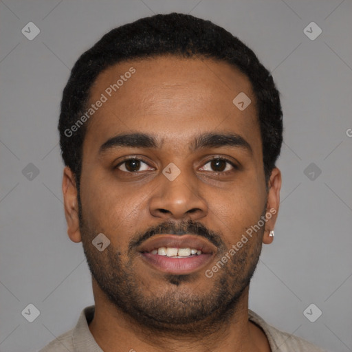 Joyful latino young-adult male with short  black hair and brown eyes