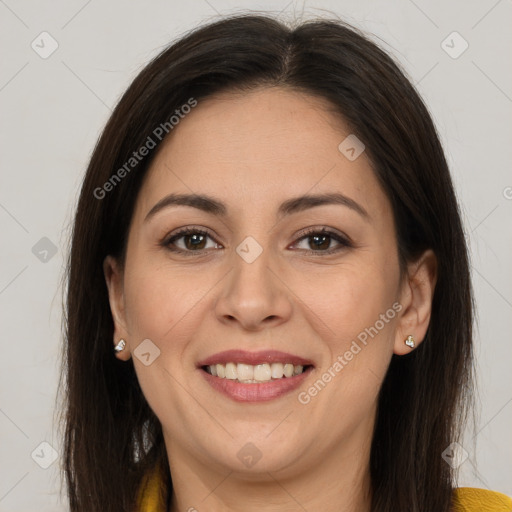 Joyful latino young-adult female with long  brown hair and brown eyes