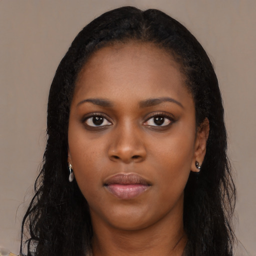 Neutral black young-adult female with long  black hair and brown eyes