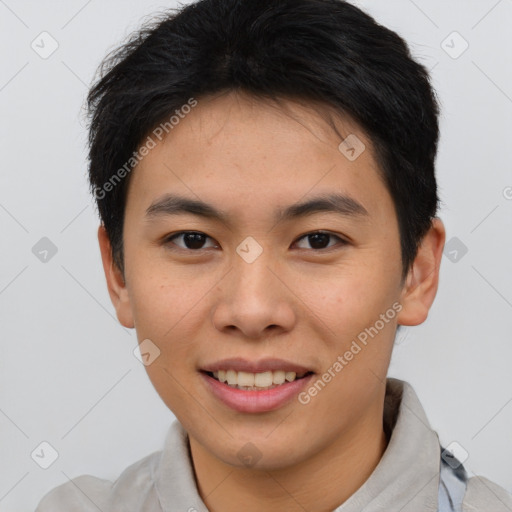 Joyful asian young-adult male with short  brown hair and brown eyes