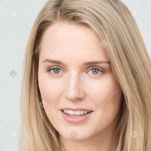 Joyful white young-adult female with long  brown hair and grey eyes