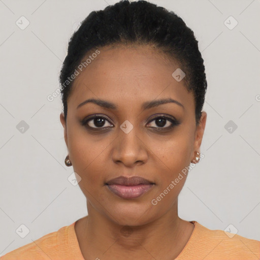 Joyful black young-adult female with short  black hair and brown eyes