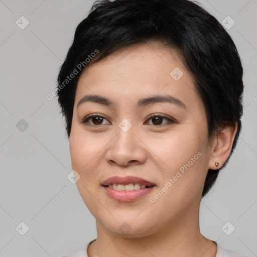 Joyful asian young-adult female with short  brown hair and brown eyes