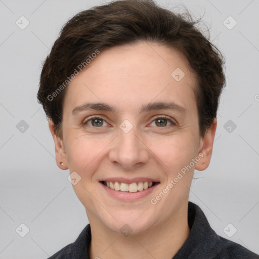 Joyful white young-adult female with short  brown hair and grey eyes