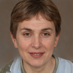 Joyful white adult female with short  brown hair and grey eyes