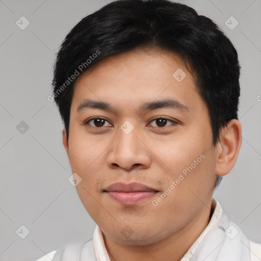 Joyful asian young-adult male with short  brown hair and brown eyes