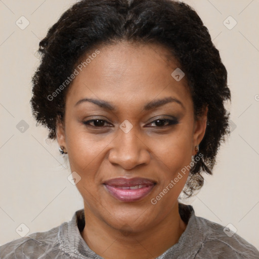 Joyful black adult female with short  brown hair and brown eyes