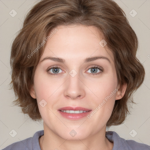 Joyful white young-adult female with medium  brown hair and blue eyes