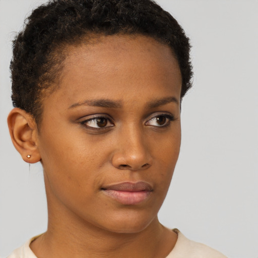 Neutral black young-adult female with short  brown hair and brown eyes