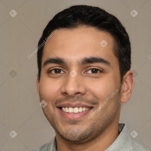 Joyful latino young-adult male with short  black hair and brown eyes