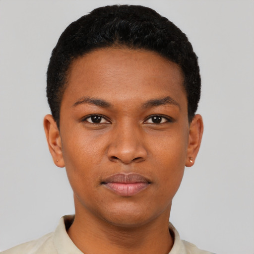 Joyful black young-adult female with short  black hair and brown eyes