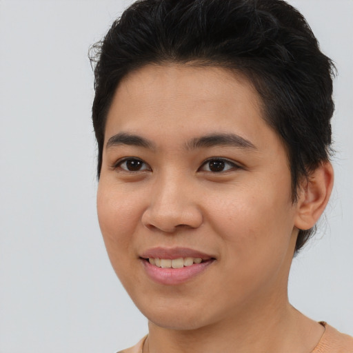 Joyful asian young-adult female with short  brown hair and brown eyes