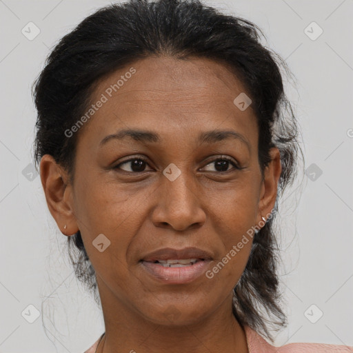 Joyful latino adult female with medium  brown hair and brown eyes