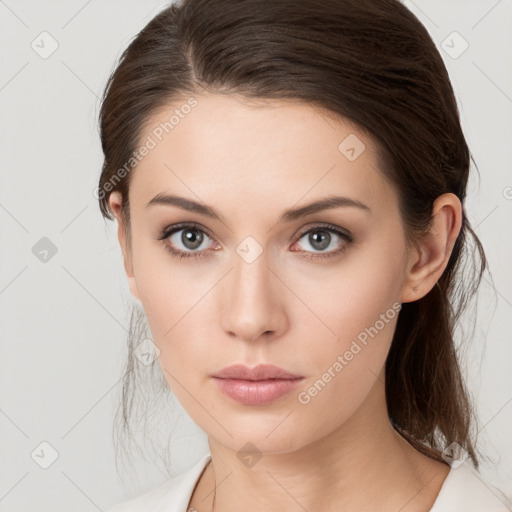 Neutral white young-adult female with medium  brown hair and brown eyes