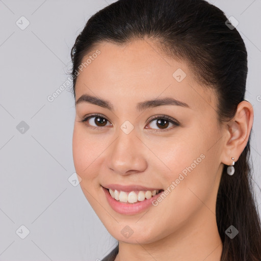 Joyful white young-adult female with long  brown hair and brown eyes