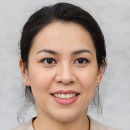 Joyful asian young-adult female with medium  brown hair and brown eyes