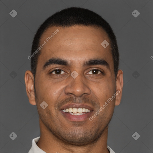 Joyful black young-adult male with short  brown hair and brown eyes