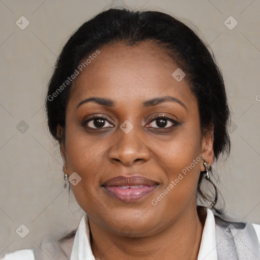 Joyful black adult female with medium  brown hair and brown eyes