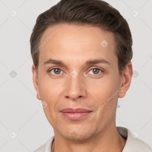 Joyful white adult male with short  brown hair and brown eyes