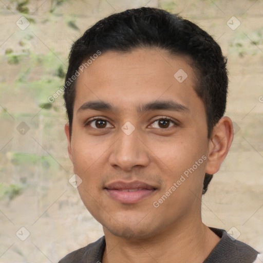 Joyful latino young-adult male with short  black hair and brown eyes