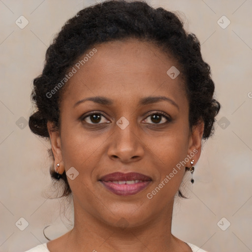 Joyful black young-adult female with medium  brown hair and brown eyes