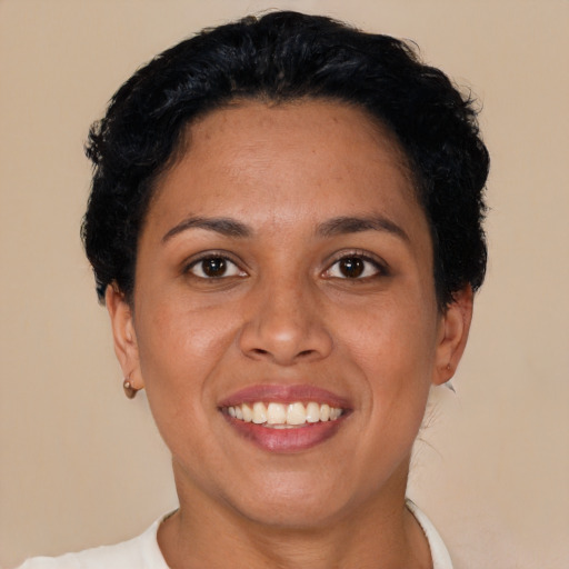 Joyful latino young-adult female with short  brown hair and brown eyes